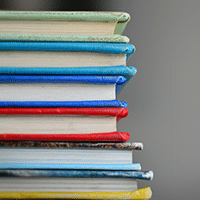 Stack of Books - Photo by Kimberly Farmer on Unsplash
