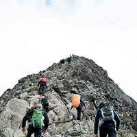 Group walking up a mountain together | Photo by Mathias Jensen on Unsplash